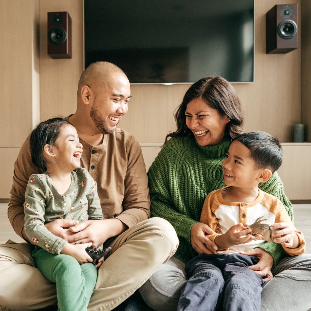 happy diverse family in living room