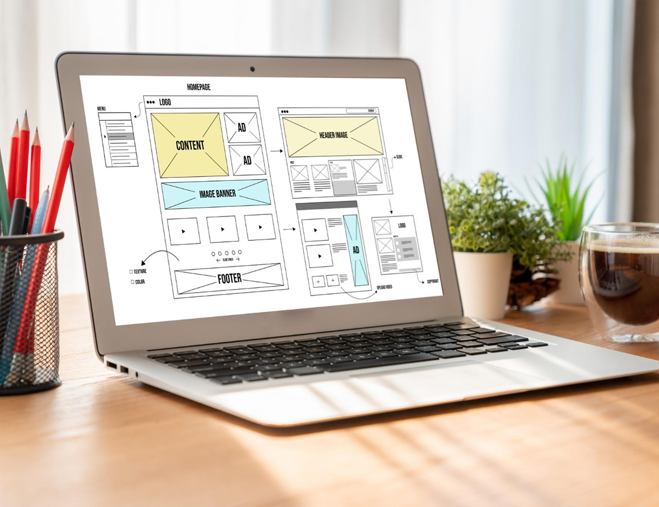 desk view of laptop with website design mockup